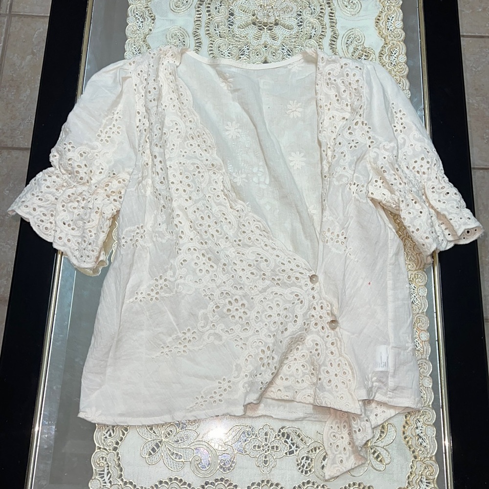 Cream eyelet short-sleeved wrap blouse with floral embroidery